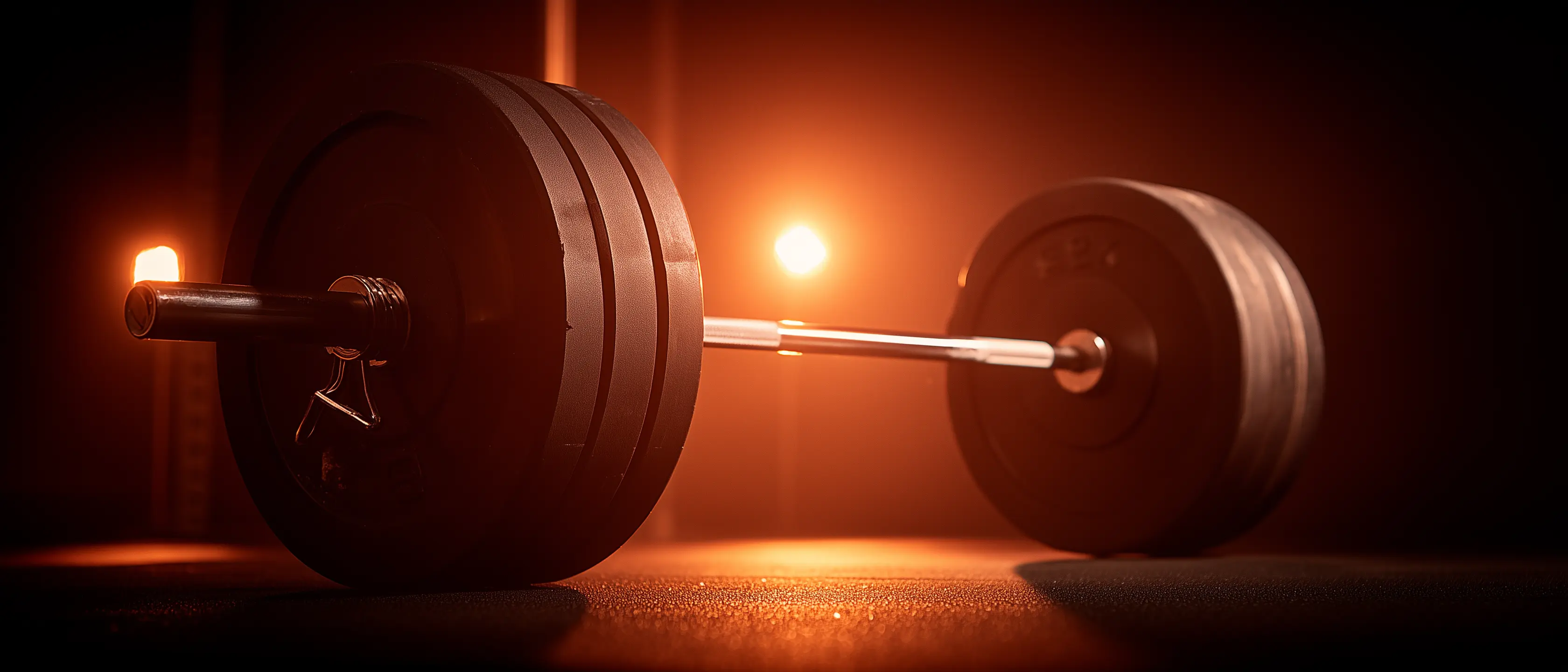 Beginner lifter reviewing workout notes in gym between sets